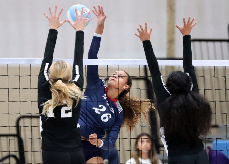 Woods Cross’ Saane Katoa hits the ball during a volleyball game against West Jordan.