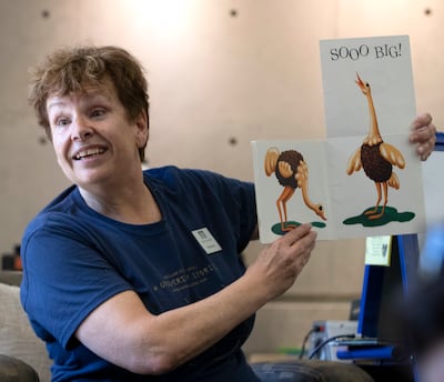 Sherrie Mortensen, associate children’s librarian at the Anderson-Foothill Library in Salt Lake City, reads a book during storytime on Wednesday, June 19, 2019.