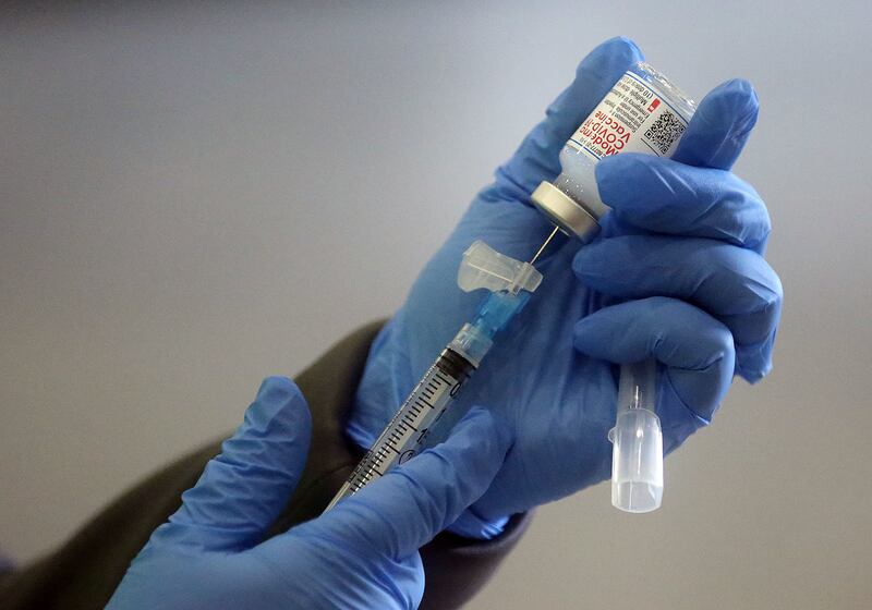 Jamie Bone prepares a Moderna COVID-19 vaccination at the Legacy Center Indoor Arena in Farmington, Utah.