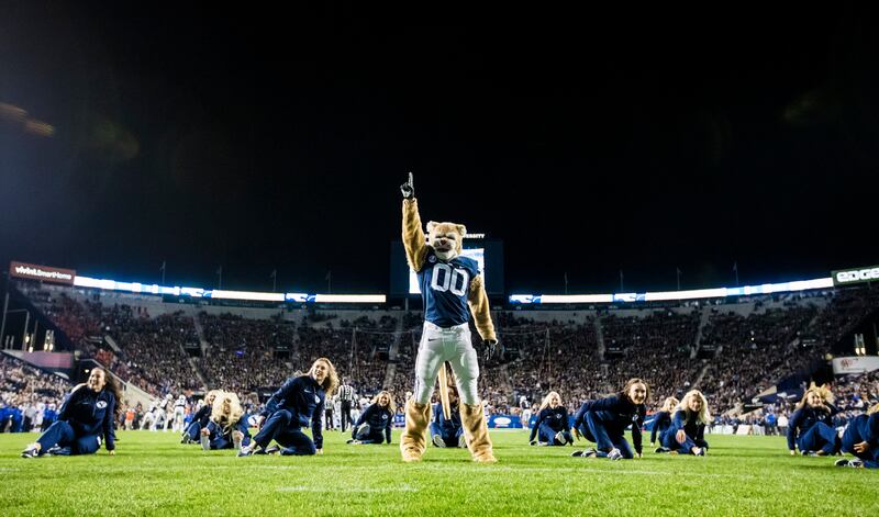 BYU’s Cosmo the Cougar performs with the BYU Cougarettes during the 2017 homecoming football game against Boise State in Provo on Oct. 6, 2017.
