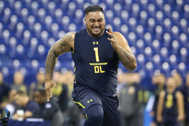 Utah offensive guard Isaac Asiata competes in the 40-yard dash at the 2017 NFL football scouting combine Friday, March 3, 2017, in Indianapolis. (AP Photo/Gregory Payan)