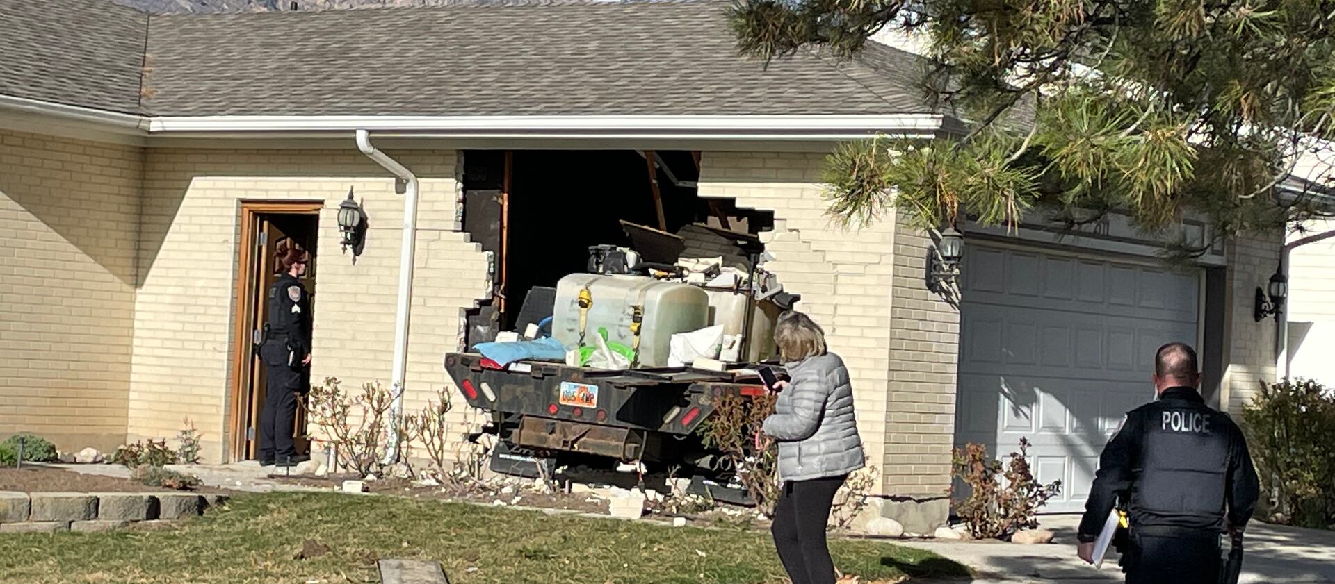 A truck crashed through the side of a house on the 2500 East block of Alta Canyon Drive in Sandy on Tuesday.