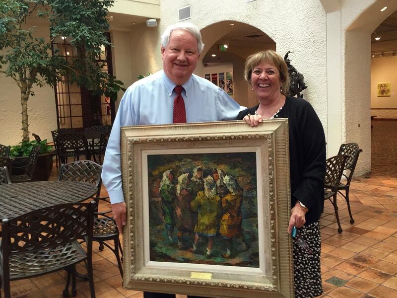 Vern Swanson, director emeritus of the Springville Art Museum, and director Dr. Rita Wright display "He Said, She Said," the modernistic painting the museum purchased in 1950 instead of Norman Rockwell's classic painting of "Ichabod Crane."