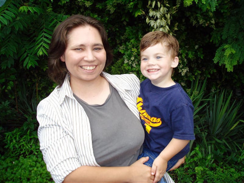 Lynndie England, the face of the Abu Ghraib prisoner abuse scandal, holds her attorney's son in Keyser, W.Va.