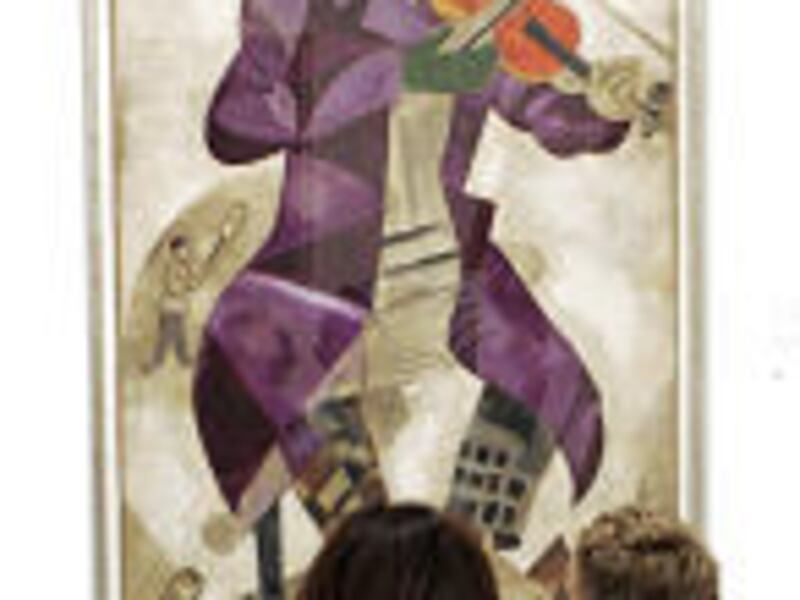 Visitors study Marc Chagall's "Green Violinist" in the Federal Art and Exhibition Hall in Bonn, Germany.