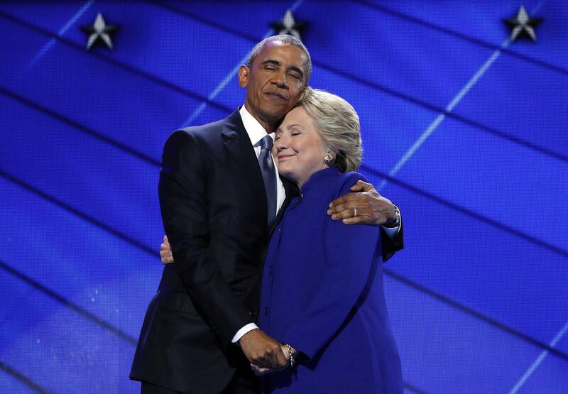 President Barack Obama hugs Democratic presidential candidate Hillary Clinton after addressing the delegates during the third-day session of the Democratic National Convention in Philadelphia, Wednesday, July 27, 2016.
