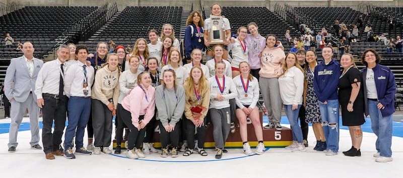 The Westlake girls wrestling team poses with the trophy after taking the 6A wrestling team championship.