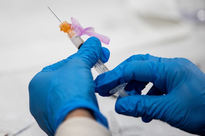 A dose of the Moderna COVID-19 vaccine is prepared in Utah.