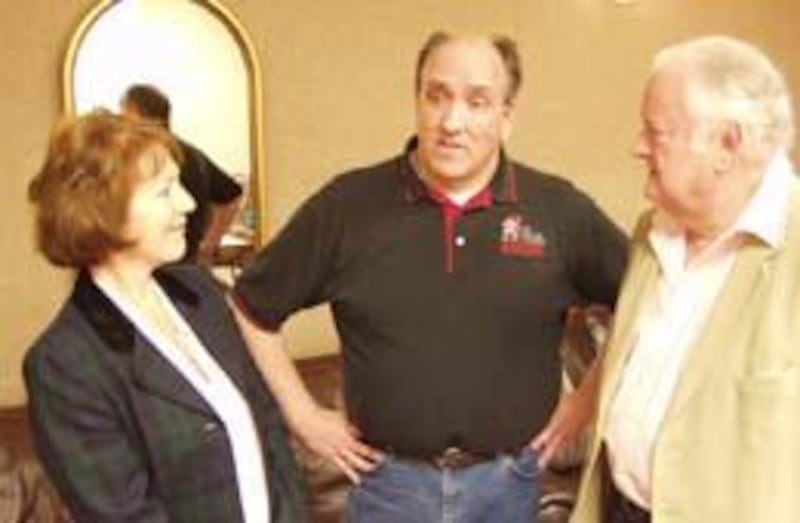 From left, Christin Burley, Bruce Bradeson and Phillip "Pip" Burley converse at Hale Centre Theatre.