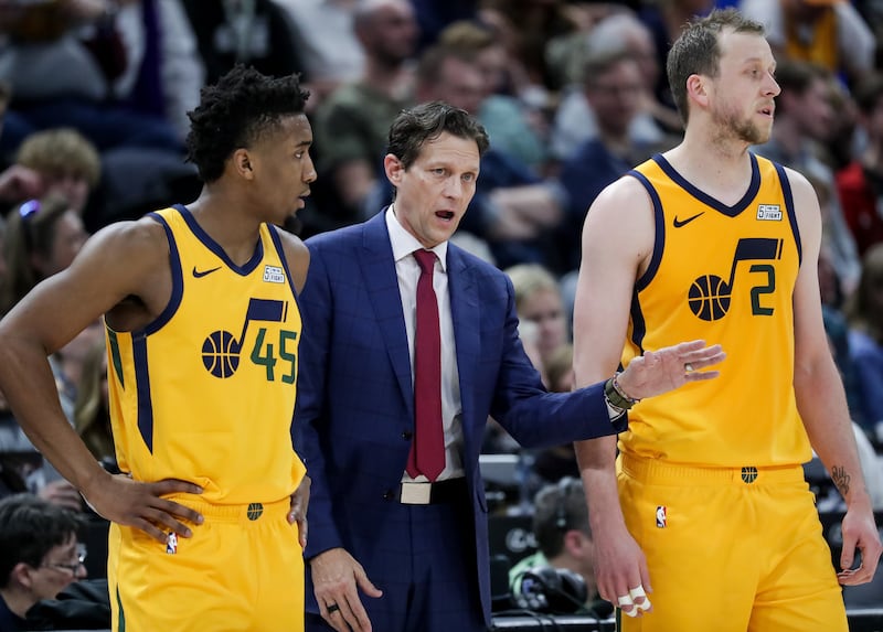 Utah Jazz head coach Quin Snyder talks to guard Donovan Mitchell (45) and center Rudy Gobert (27) during the game against the Chicago Bulls at Vivint Smart Home Arena in Salt Lake City on Saturday, Jan. 12, 2019.