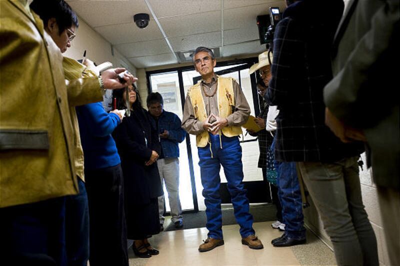 Navajo Nation President Joe Shirley talks with supporters and reporters after submitting his ballot for the line item veto and council reduction vote at the Navajo Election Administration office in Window Rock, Ariz., on Tuesday.