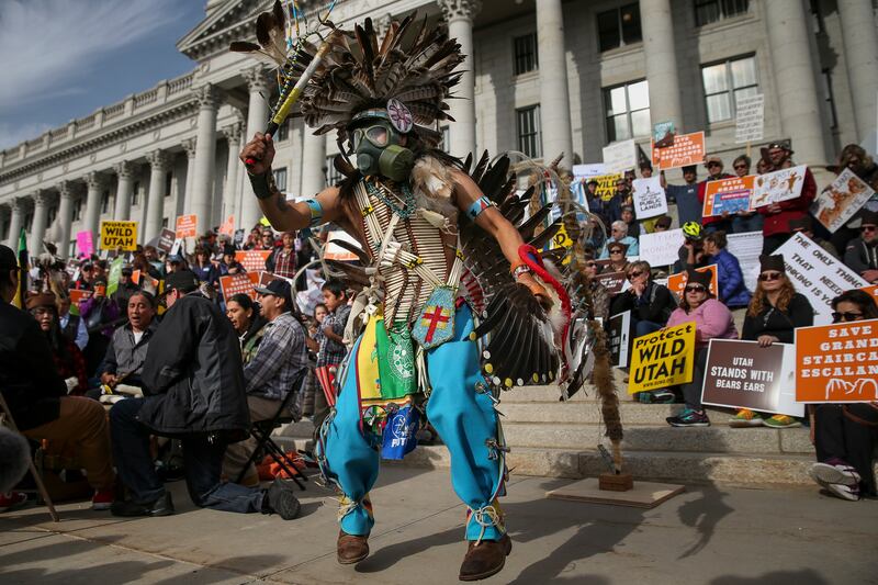 Carl Moore, chairman of Peaceful Advocates for Native American Dialogue and Organizing Support, dances during a rally in support of Bears Ears and Grand Staircase-Escalante national monuments at the state Capitol in Salt Lake City on Saturday, Dec. 2, 201