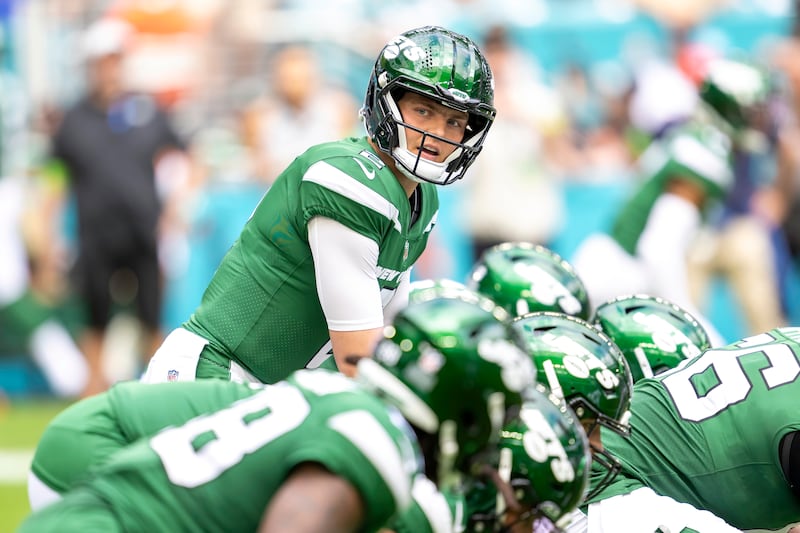 New York Jets quarterback Zach Wilson (2) prepares to take the snap during an NFL game against the Miami Dolphins on Dec 17, 2023.