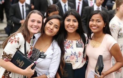 Sister missionaries smile after meeting with President Russell M. Nelson of The Church of Jesus Christ of Latter-day Saints in Lima, Peru on Oct. 20, 2018.