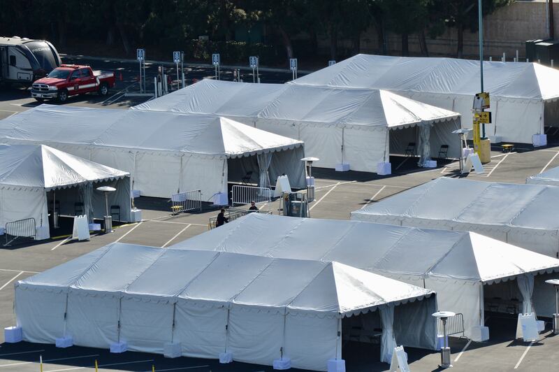 COVID-19 vaccination tents are set up in the north of the Toy Story parking lot at the Disneyland Resort on Tuesday, Jan. 12, 2021, in Anaheim, Calif.