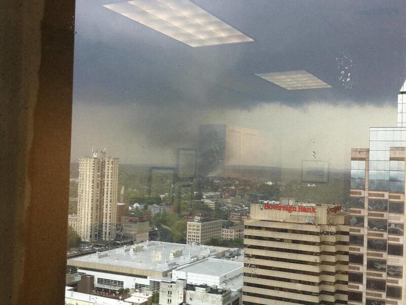In this photo provided by John Garvey, a tornado moves through Springfield, Mass., Wednesday, June 1, 2011. An apparent tornado struck downtown Springfield, Mass., one of the state's largest cities, scattering debris, toppling trees, and frightening worke