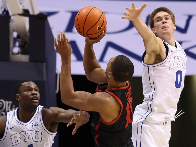 BYU forward Atiki Ally Atiki (4) and Noah Waterman (0) double-team San Diego State forward Jaedon LeDee (13).