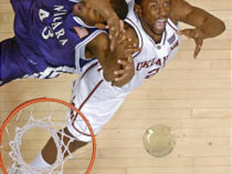 Oklahoma forward Taj Gray, right, and Niagara forward Juan Mendez, left, fight for a rebound in the first half Thursday in Arizona.