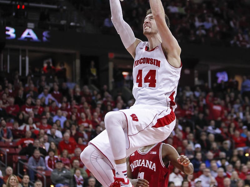 FILE - In this Feb. 3, 2015, file photo, Wisconsin forward Frank Kaminsky dunks against Indiana during the second half of an NCAA college basketball game in Madison, Wis. Kaminsky was selected to the AP All-America team, Monday, March 30, 2015.