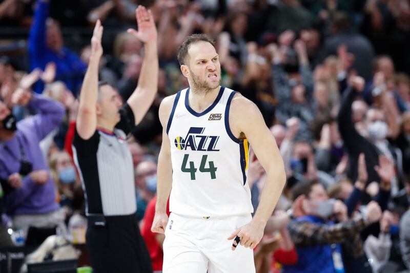 Utah Jazz forward Bojan Bogdanovic, wearing white, reacts after scoring a 3-pointer