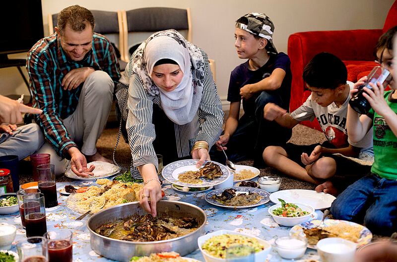 The Hamad and Hredeen families and volunteer families share iftar during Ramadan at the Hredeen's home in Millcreek on Tuesday, June 6, 2017. Iftar is the evening meal when Muslims end their daily Ramadan fast at sunset.