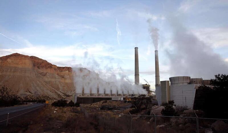 The Huntington Power Plant in Huntington, Utah. In the foreground are the cooling towers that disperse harmless steam.