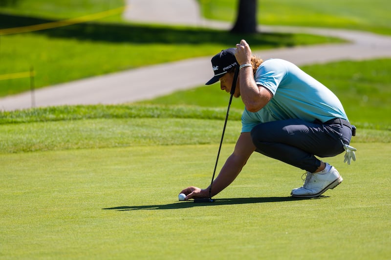 Carson Lundell (Alpine) sets up his ball in the opening round of KFT’s Utah Championship at Oakridge Country Club in Farmington on Thursday, Aug. 3, 2023.