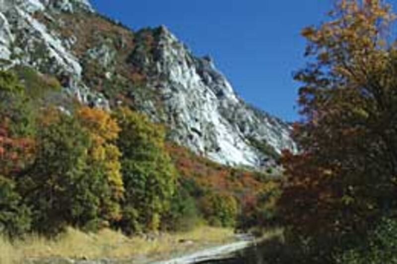 Mountain biking trail at Temple Quarry is on grade of former railroad used to carry stones quarried for construction of Salt Lake Temple and other structures.