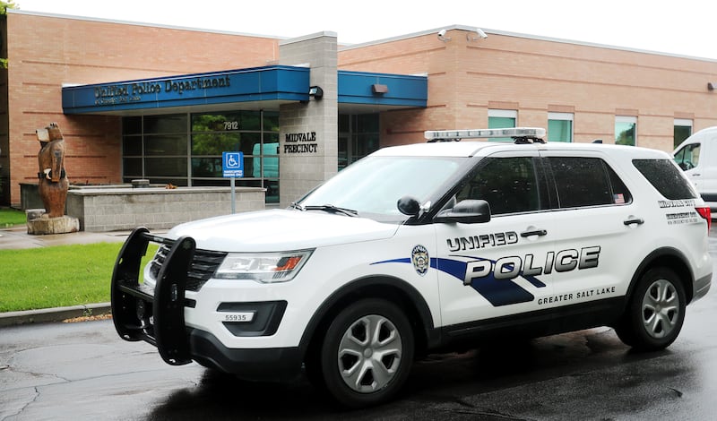 An officer drives his vehicle out of the parking lot at the Unified Police Department’s Midvale Precinct.