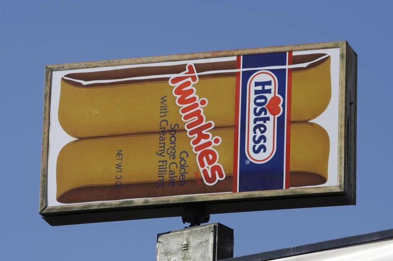 FILE - A Hostess Twinkies sign is shown at the Utah Hostess plant in Ogden, Utah, in this Nov. 15, 2012 file photo. Hostess Brands Inc. says it's in talks with more than 100 parties interested in buying its brands, which include Twinkies, Ding Dongs and