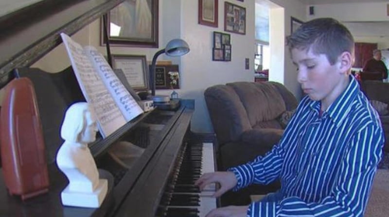 Heston Warr plays the piano at his Grouse Creek home on Tuesday, Jan. 31, 2012. His parents thought he would be a rancher when he grew up, like his father and grandfather, but he had something else in mind. He hopes to one day go to Juilliard, then London