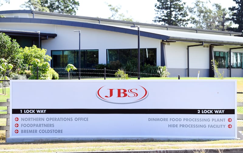 The company logo sign sits at the entrance to the JBS Australia’s Dinmore meatworks facility.