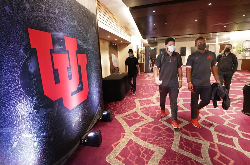 Utah linebacker Nephi Sewell, left, and cornerback Clark Phillips III leave a Rose Bowl press conference, Dec. 29, 2021.