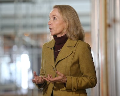 Nancy Volmer, spokeswoman for the Salt Lake City International Airport, gives an interview next to large wall that is being built for an art piece inside the new terminal on Thursday, April 4, 2019. Artists are being sought to create an installation for t