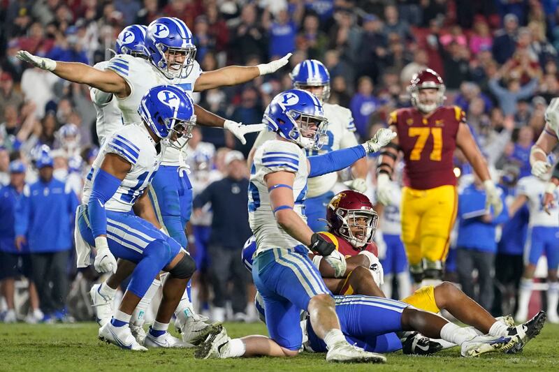 BYU players celebrate after stopping Southern California wide receiver Gary Bryant Jr. (1) short of a first down to turn over the ball.