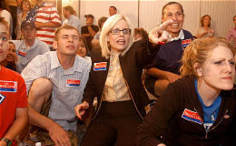 Deputy campaign manager Debbie Huckstep, center, celebrates as she sees John Swallow win in Washington County.