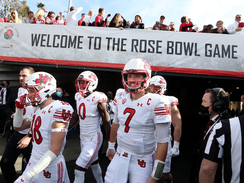The Utah football team walks onto the field on Jan. 1, 2022, for the game against Ohio State in the Rose Bowl in Pasadena, Calif.