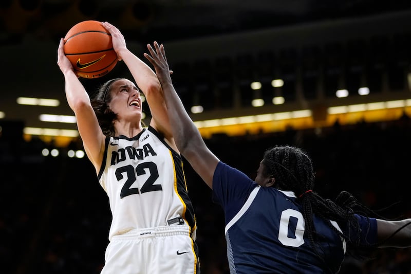 Iowa guard Caitlin Clark (22) is fouled by Penn State guard Ashley Owusu (0) during the first half of a game, Thursday, Feb. 8, 2024.