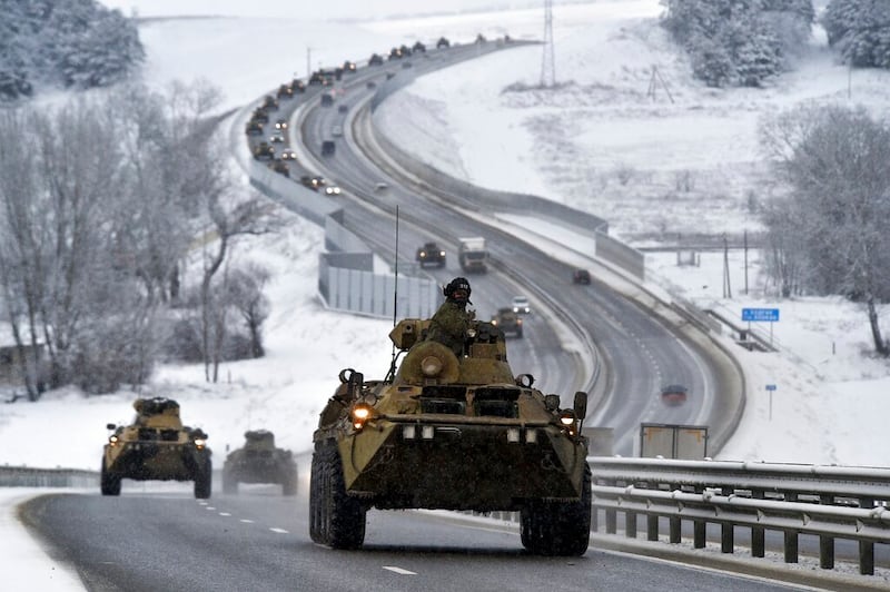 Russian armored vehicles moves along a highway in Crimea.