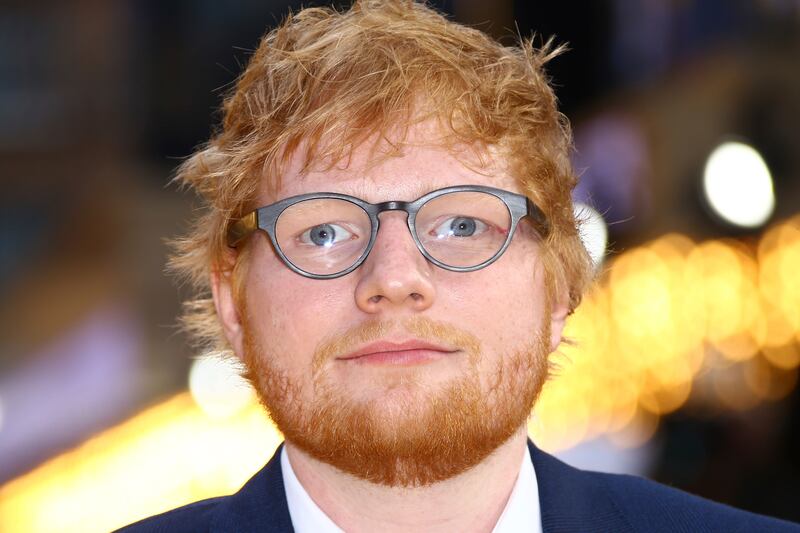 FILE - In this June 18, 2019 file photo, singer Ed Sheeran poses for photographers upon arrival at the premiere of the film 'Yesterday' in London. Sheeran’s Divide Tour is one for the record books. Pollstar confirms the 28-year-old British singer’s tour w