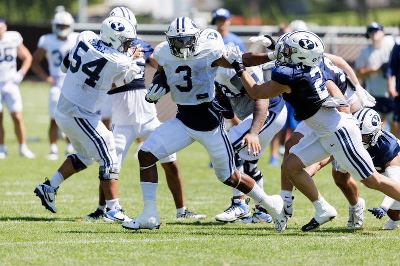 UNLV transfer running back Aidan Robbins fights for yardage during practice at the BYU practice facility.