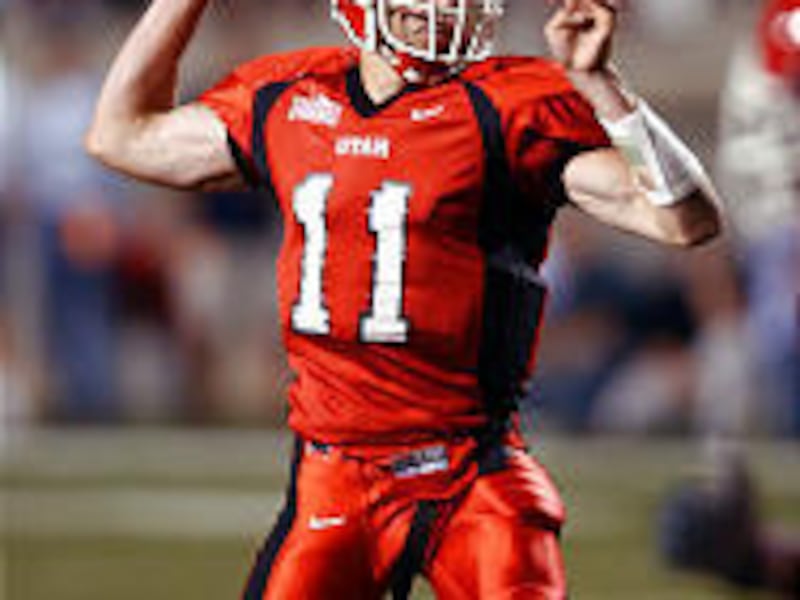 Utah's Alex Smith drops back for a pass during action against Utah State on Aug. 28, 2003. Smith has a 66.1 percent pass completion record.