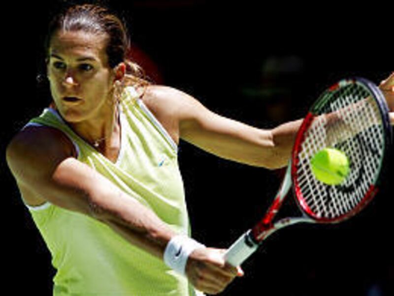 France's Amelie Mauresmo makes a backhand return during her third- round match against Ana Ivanovic, of Serbia and Montenegro, at the Australian Open.