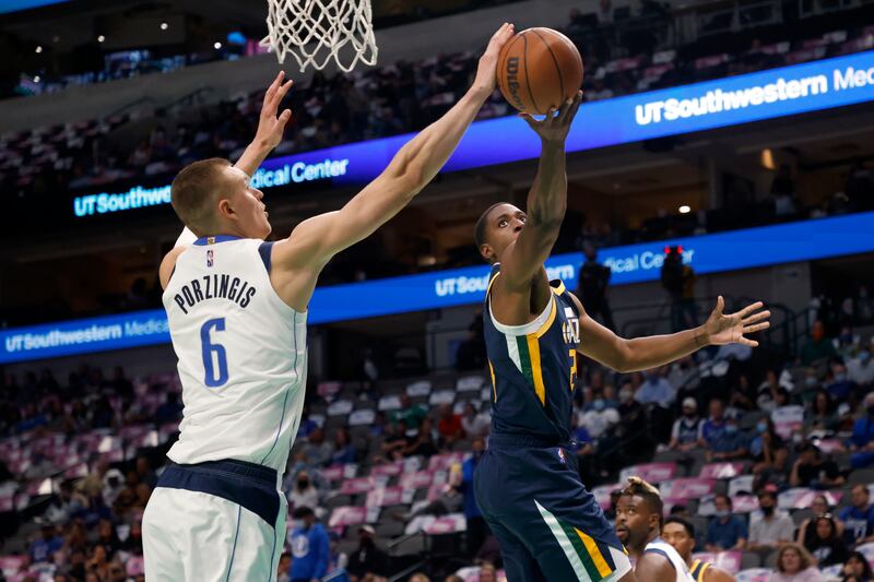 Dallas Mavericks forward Kristaps Porzingis (6) blocks a shot attempt by Utah Jazz’s Malik Fitts.