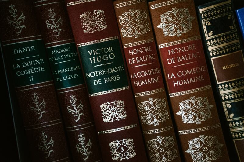 Old books including one by Victor Hugo.