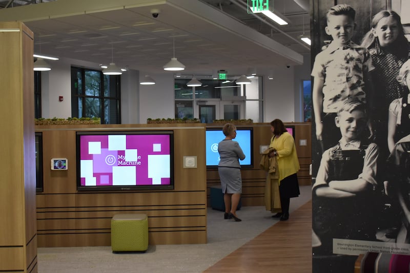 Visitors to the April 30, 2019, dedication services of the new Ogden Utah FamilySearch Center walk throught the interactive media on the main floor.