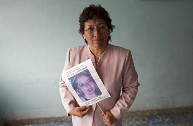 Adela Alvarado, the mother of kidnap victim Monica Alejandra Ramirez, holds a picture of her daughter at a family member's home in Mexico City.
