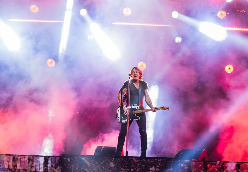 Keith Urban performs "Never Comin' Down" at the 52nd annual CMA Awards at Bridgestone Arena on Wednesday, Nov. 14, 2018, in Nashville, Tennessee. Urban will headline this year's Stadium of Fire in Provo on July 4.