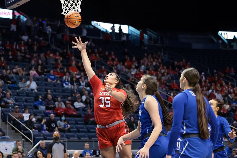 Utah Utes forward Alissa Pili (35) goes to the hoop during a game against the BYU Cougars at the Marriott Center in 2022.