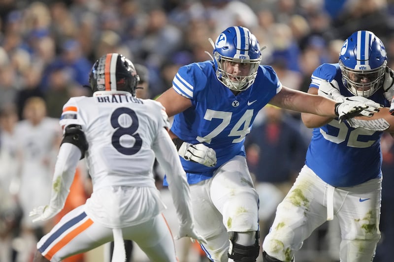 BYU offensive lineman Campbell Barrington (74) looks to block defensive back during game Oct. 30, 2021, in Provo, Utah.